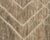 Earth in motion: bold ivory lines sweeping across bands of warm, weathered taupe. A richly layered field of light taupe,...