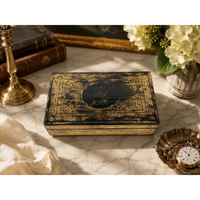 A stunning 19th-century Anglo-Indian lacquered jewelry or keepsake box, crafted in Kashmir for the British colonial market...