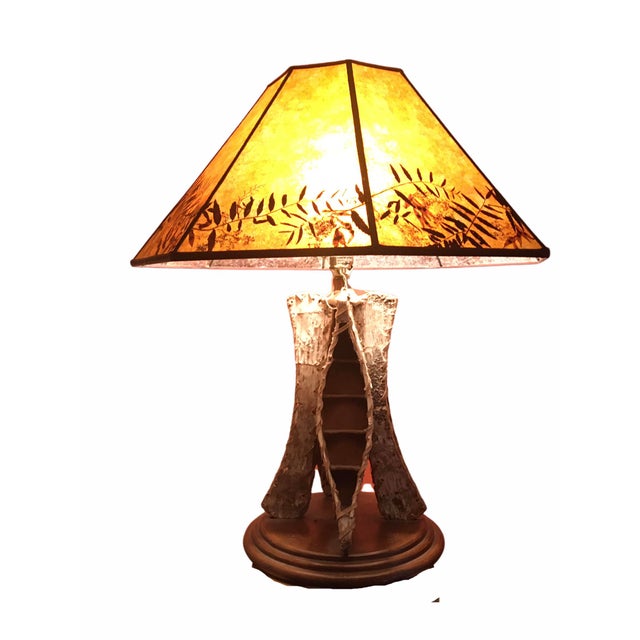 Unique vintage table lamp. This piece features a body encircled with small scale canoes of birch bark wood (perfect...