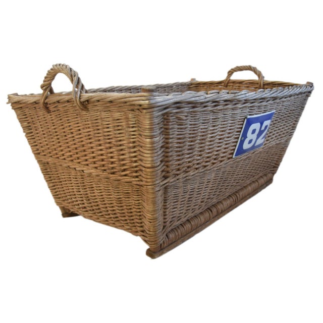 Large vintage woven willow/wicker basket with braided rim and handles, sturdy woven bottom, and blue and white enameled...