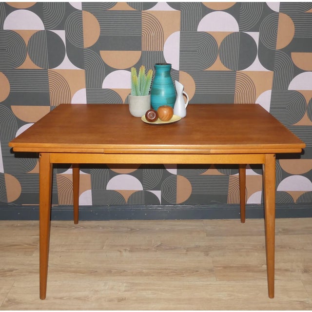 Beautifully shaped, delicate dining table Teak real wood veneer with a slightly concave tabletop Small and elegant, yet...