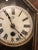 A 30 hour clock with a pine cabinet and burl rosewood outer door. It is in working order and has the original finish and...