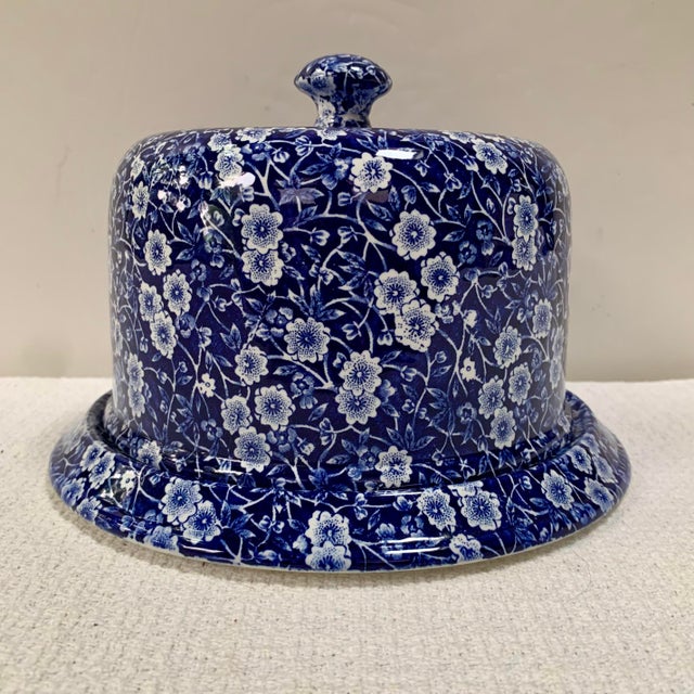 Cranford Staffordshire "Calico" domed Cheese plate. It has a rich blue color with a white scrolling blossom design. The...