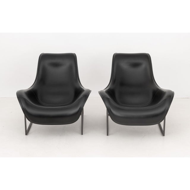 Antonio Citterio (Italian, b. 1950) for B & B Italia Pair of "Mart" Black Leather Arm Chairs, each with reclining...
