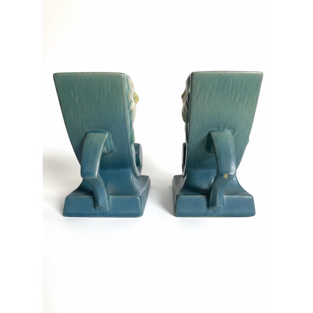 A beautiful matching pair of vintage Roseville Pottery Clematis cornucopia vases, shape 193-6”, dating to the 1940s. These...
