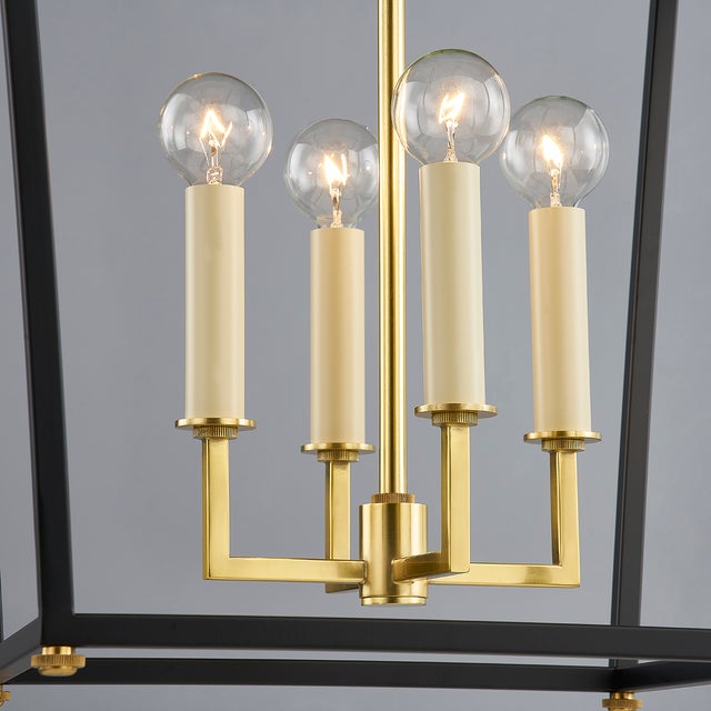 Natick is clean, open, and airy. The double roofline stands out from a traditional lantern, while the Aged Brass metal...