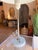 This mid-century modern inspired table lamp showcases a sleek, minimalist silhouette with clean lines and understated...