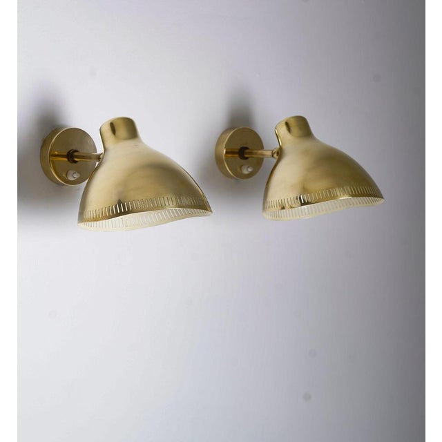 This pair of wall lamps, designed by hans bergström for asea circa 1950, epitomizes the swedish modern style. Crafted in...