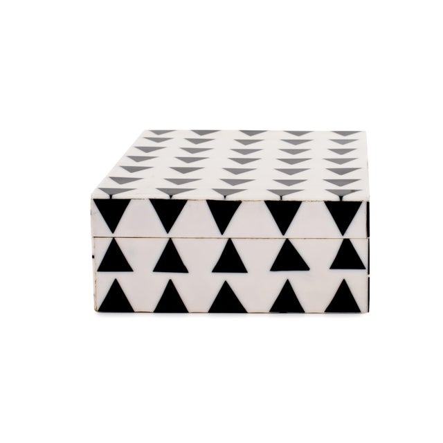 Crafted with meticulous attention to detail, this box exudes the timeless charm of the Art Deco era. Its crisp white...