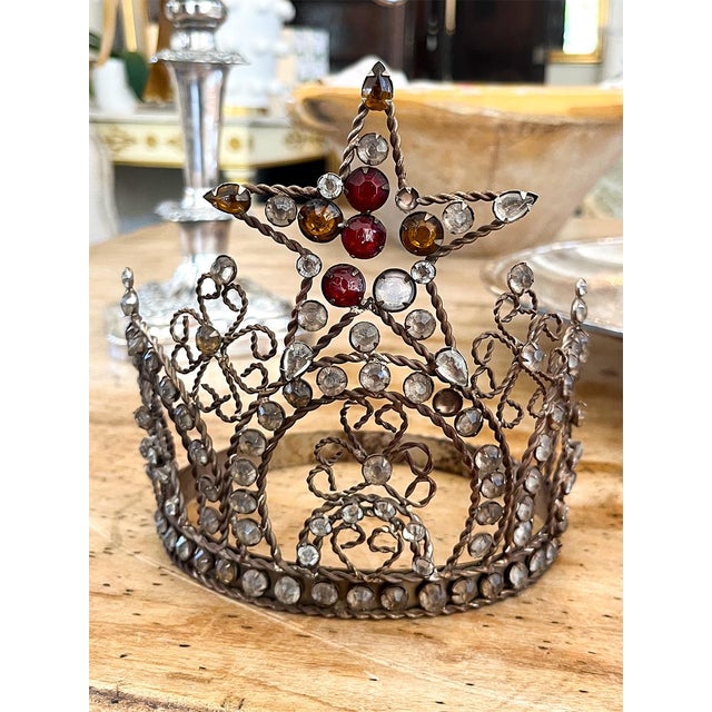 This piece is crafted from twisted ironwork and colored glass jewels. The piece looks great on a bookcase or desk....