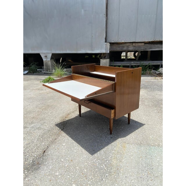 American of Martinsville dry bar or petite storage console with fold-over top. Top door features a 180° fold-over piano...