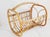 Mid-Century Boho style handcrafted bamboo and rattan magazine rack or organizer. Featuring a bent cane handle and details...