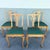 A refined set of vintage Chippendale-style dining chairs, showcasing timeless craftsmanship and elegant detailing. Each...