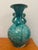 This is an antique chinoiserie style porcelain vase. It has a glossy coat. In the style, it is often referred to as...