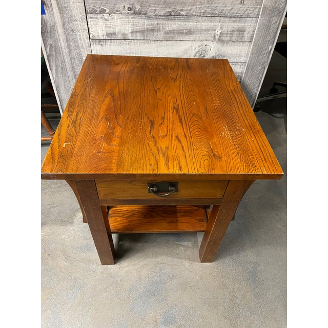 Mid-Century Modern sturdy solid wood table with a single drawer.