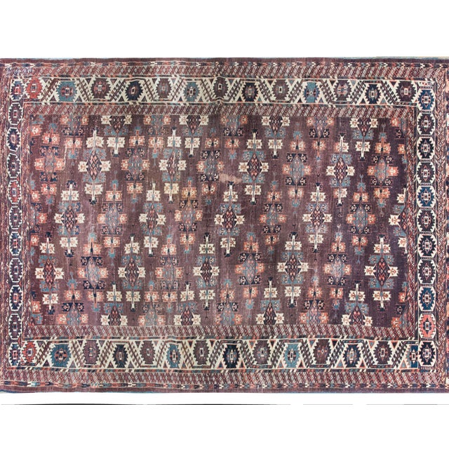 A wonderful early 20th century Persian Turkmen rug with myriad medallions across the field, and surrounded by an expertly...