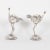 Fanciful pair of Mid-Century ostrich bird sculptures constructed with ostrich eggs and silvered metal. Wearing a quizzical...