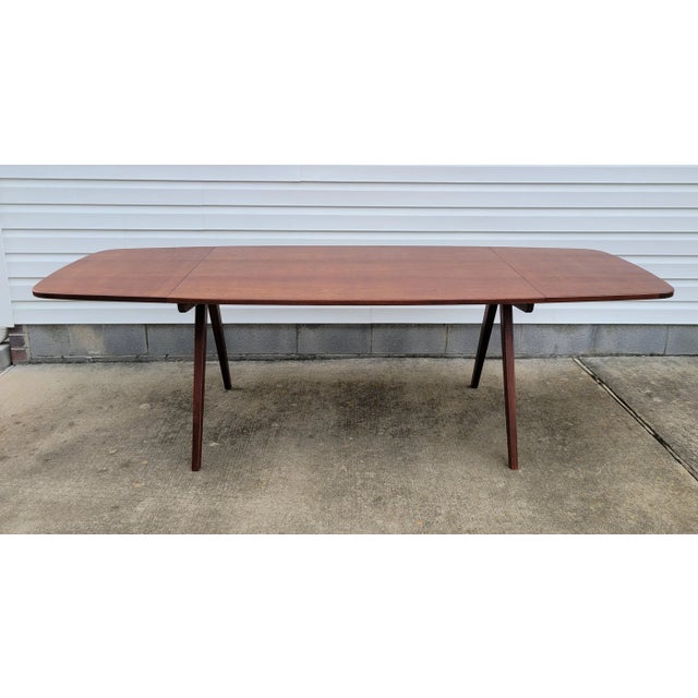 Iconic Danish Mid Century design, this drop leaf teak dining table is designed by architect Poul Vother, cabinet maker...
