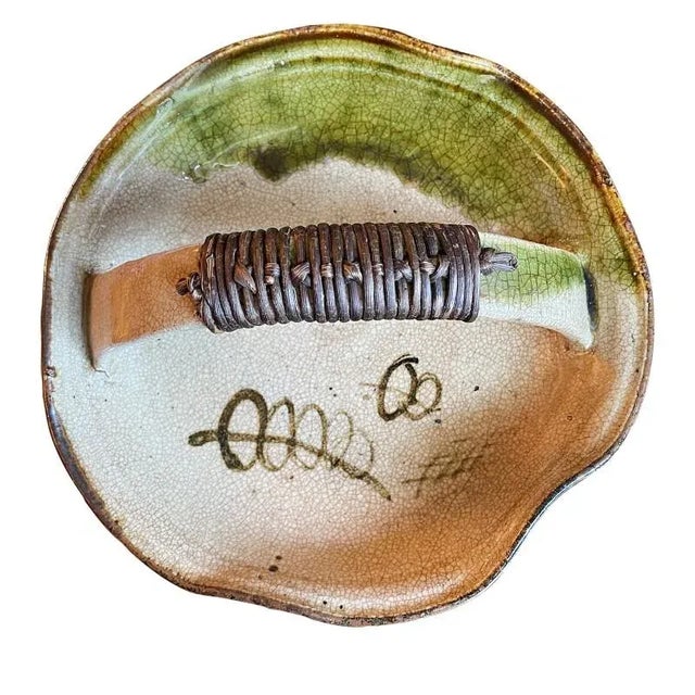Antique Japanese ceramic dish used for candy or sweets from the Meiji period. Traditional oribe glaze in cream, green and...
