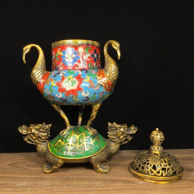 A striking Chinese Cloisonné enamel incense burner (censer). The vessel is supported by a green-enameled turtle base, from...