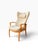 OVERVIEW A tall Danish modern wingback recliner, attributed to Farstrup of Denmark, upholstered in a creamy bouclé....