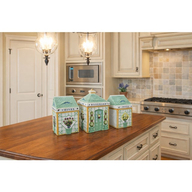 Whimsical, sculptural, and full of garden charm — this collectible set of ceramic canisters was designed by Holly...