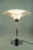 This vintage 4/3 table lamp, designed by Poul Henningsen, was produced by Louis Poulsen in the 1980s. Labeled by...