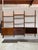 This three-bay modular shelving system offers a versatile wall-mounted storage solution. It features customizable shelves...