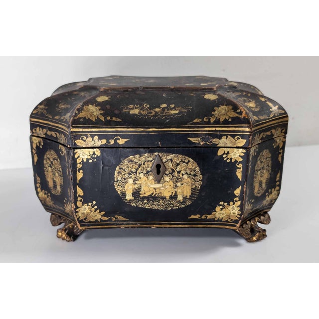 We are selling this 19th century Chinese export black lacquer tea caddy with gilt decoration. This tea caddy has original...