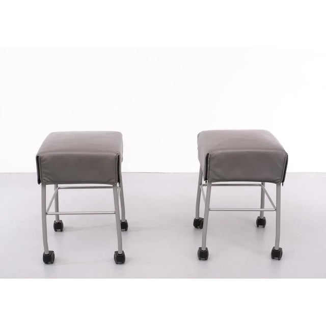 Very nice set of Samba seating stools on wheels . Top quality Grey Leather its covering the frame like a coat . Grey Metal...