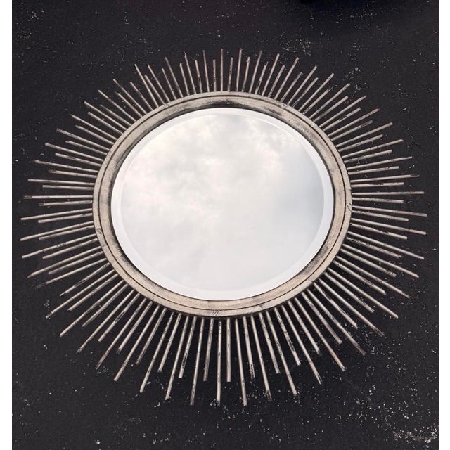 Midcentury brutalist extra large and heavy metal sunburst mirror. Silver leaf and brush black finish with a beautiful...