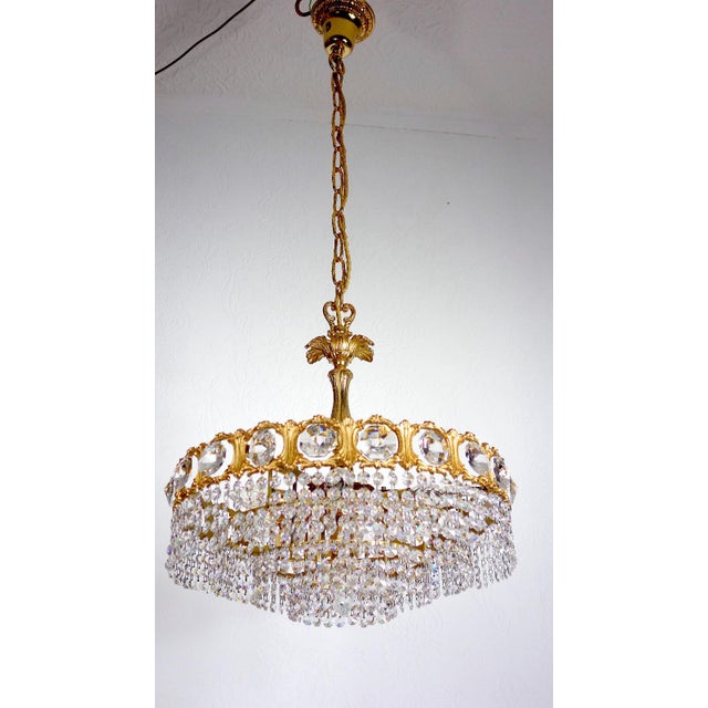 Brass and Lead Crystal Chandelier from Schröder & Co., 1970s, in Very Good conditions. Designed 1970 to 1979 This piece...