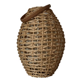 Late 20th Century Two’s Company Oval Rattan Lantern With Leather Look Handle and Glass Insert For Sale