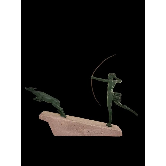 A graceful female figurine, Diana hunting an antelope with a bow made by Marcel Bouraine (Demarco) for the Foundry Verrier...
