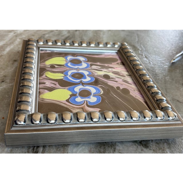 Groovy flowers handpainted in watercolor against hand-marbled and painted background. New. In a new silver, architectural,...