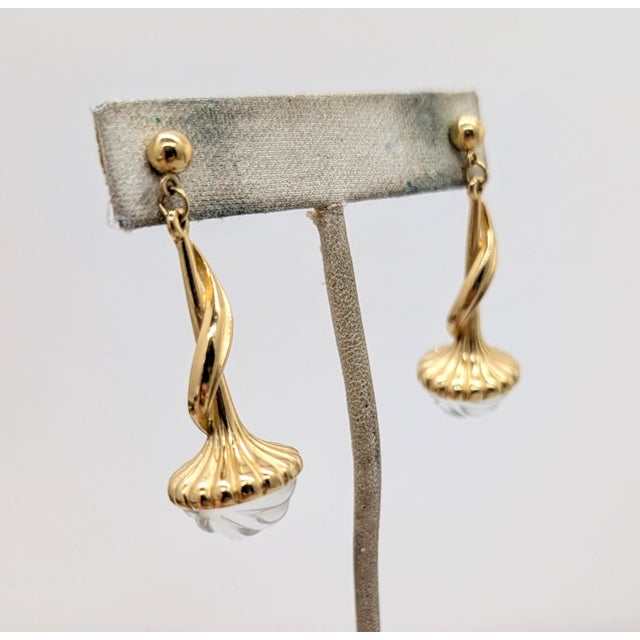 1990s goldtone long drop with round clear melon rhinestone at the bottom pierced push back earrings. Marked "TRIFARI TM"...