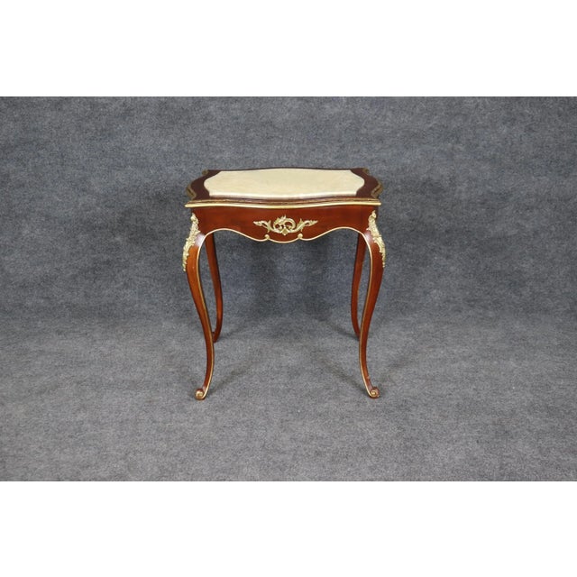 This exquisite Louis XV style center table captures the timeless refinement of 18th-century French design, blending...