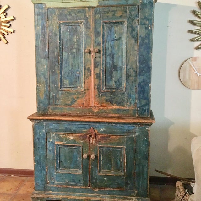 This cupboard is over 100 years old and retains its original blue paint. The piece features double doors on the top and...