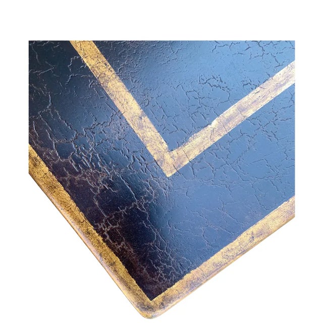 Beautiful pair of vintage wood faux brown painted tables with gold painted accents. Tables have tapered legs with gold...