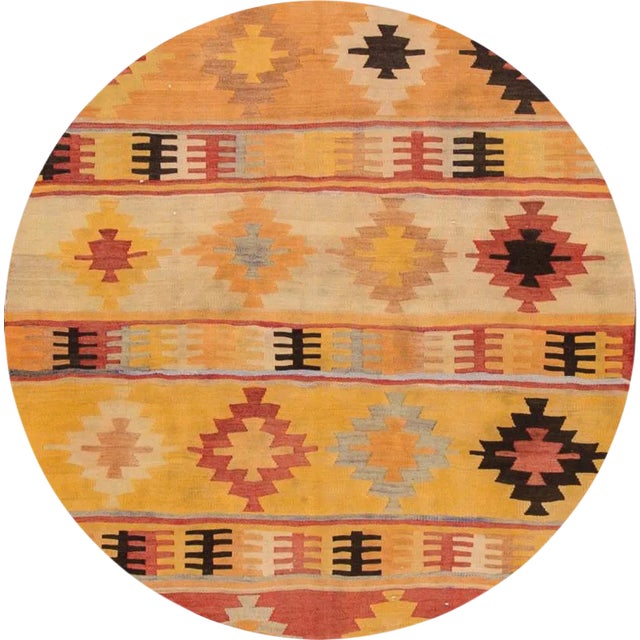 Vintage handwoven Turkish Kilim with an allover geometric motif on a yellow field. This gorgeous runner has magnificent...
