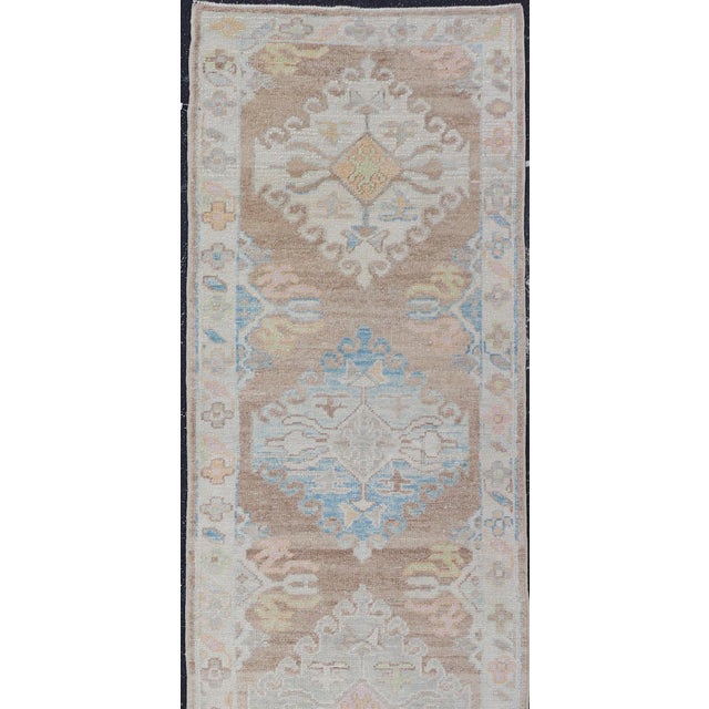 Long Turkish Oushak Runner With Pale Blue, Soft Yellow, and Light Brown Motifs For Sale - Image 4 of 13