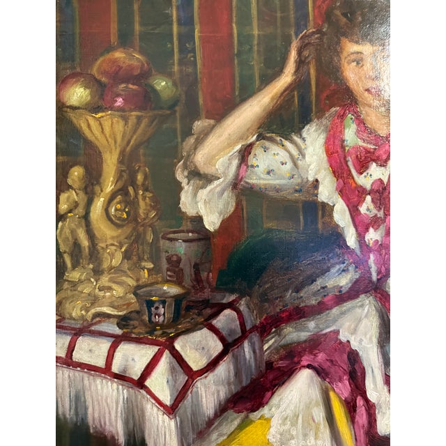 An original Jan Sluijters (1881-1957) Oil on Canvas depicting a young lady looking into a mirror set in an ornate frame....