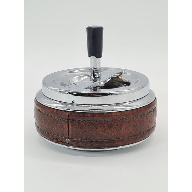 Vintage Erhard Ashtray in Chrome and Leather, 1950s, in Very Good conditions. Designed 1950 to 1959 This piece has an...