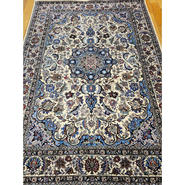 "A beautifully handwoven vintage Tabriz-design Persian area rug, hand-knotted in India during the third quarter of the...