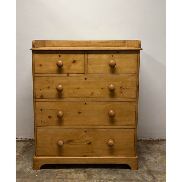 There is a quiet dependability to a well-made English chest of drawers — a piece built to serve without fuss, yet carrying...