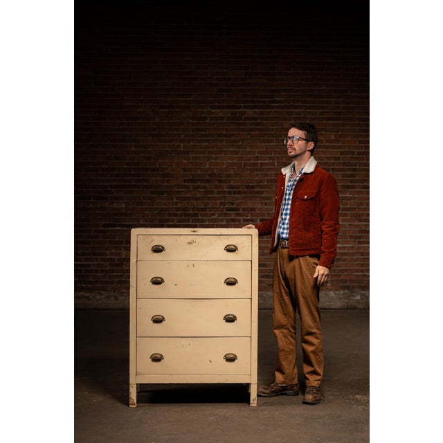 c. 1940s-1950s; Simmons Manufacturing Co. - Kenosha, WI A tall, four-drawer steel dresser finished in a soft cream enamel-...