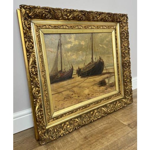 This charming Vintage French signed painting captures a serene coastal scene with boats resting along the shore,...