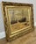 This charming Vintage French signed painting captures a serene coastal scene with boats resting along the shore,...