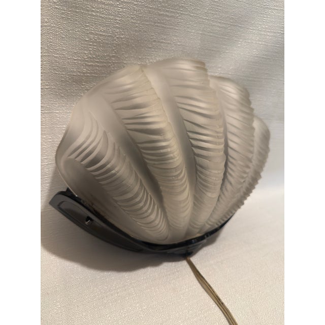 Presented by Turtle and Crane, this breathtaking 1981 Sarsaparilla Deco Designs sconce is a masterful 1980s Art Deco...