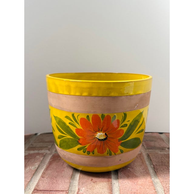 Vintage glazed terracotta planter / cachepot from Italy features a vibrant yellow background with a repeating orange...